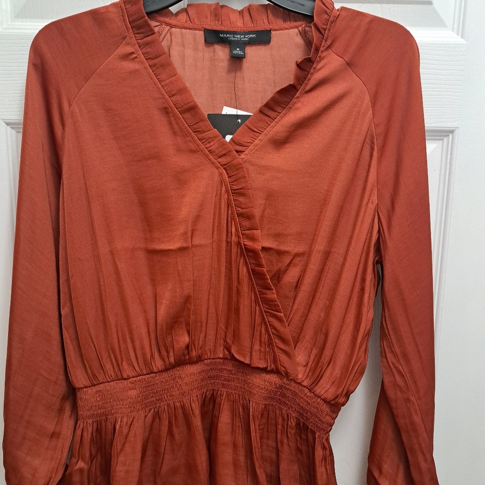 Beautiful silk blouse ready to be paired with your choice of skirt or pants.